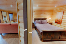 Une des chambres et salondu chalet Aponi - Selenia Lodge