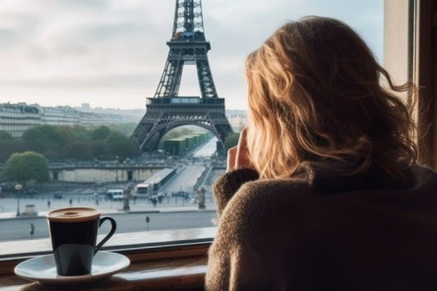Woman enjoying a cup of coffee in Paris